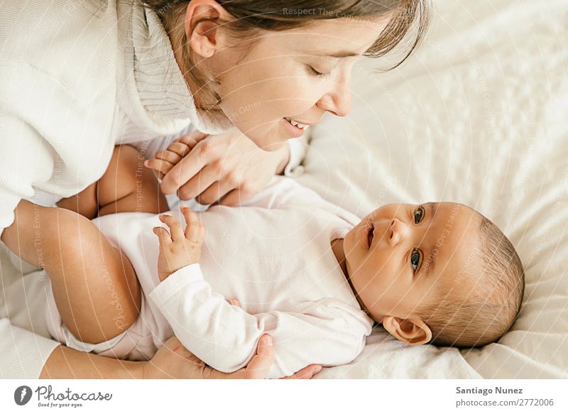 Portrait of a mother with her baby at home. Baby Mother Love Family & Relations Youth (Young adults) Beautiful motherhood Child Considerate Human being