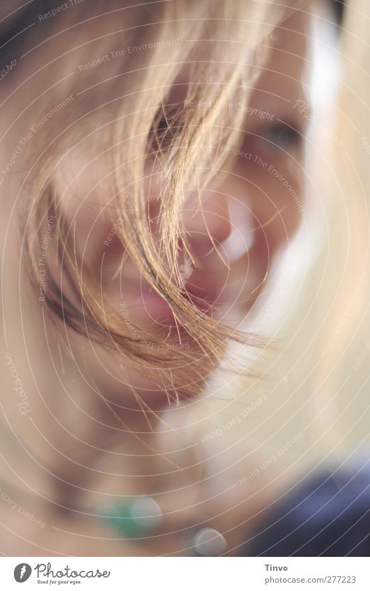 blurred portrait of a laughing woman with strand of hair in focus Feminine Woman Adults Face 1 Human being Hair and hairstyles Brunette Smiling Friendliness