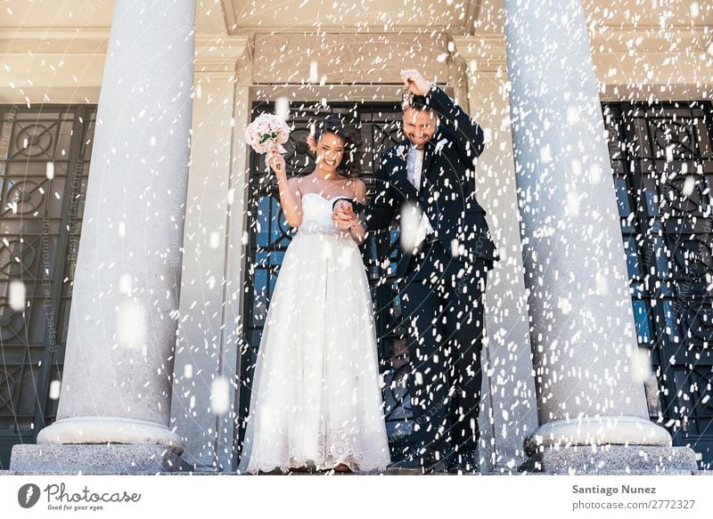 Newly married couple leaving the church. Wedding Rice throwing Family & Relations newlywed Happy Couple Married Bride Human being Woman White Man Love