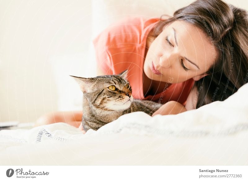 Happy woman kissing her cat in bedroom Cat Woman Girl Embrace Animal Pet Kissing Kitten Cute Beautiful Human being Love Home Face Fashion White Hair Caucasian