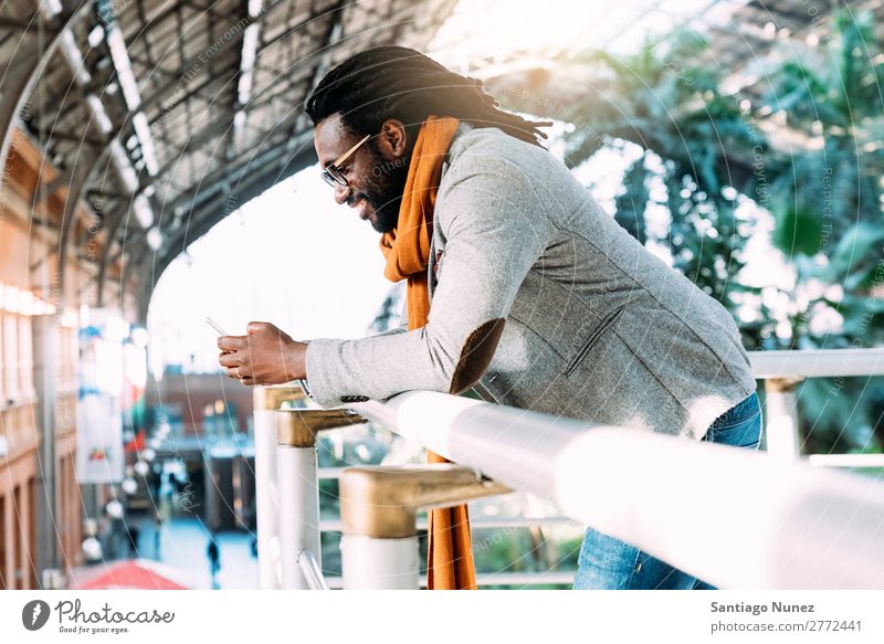 Businessman in the Train Station. Man Black African American Cellphone Youth (Young adults) Telephone Happy Mobile Interior shot Street PDA Office Human being