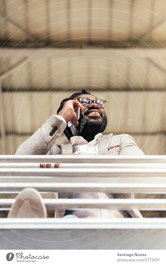 Businessman in the Train Station. Man Black African American Cellphone Youth (Young adults) Telephone Happy Mobile Interior shot Street PDA Office Human being