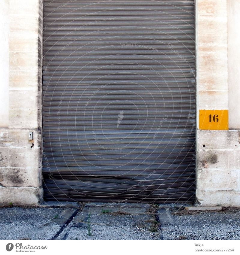 Avoid gate 16! Outskirts Deserted Industrial plant Gate Wall (barrier) Wall (building) Logistics Digits and numbers Line Broken Gloomy Mysterious Destruction