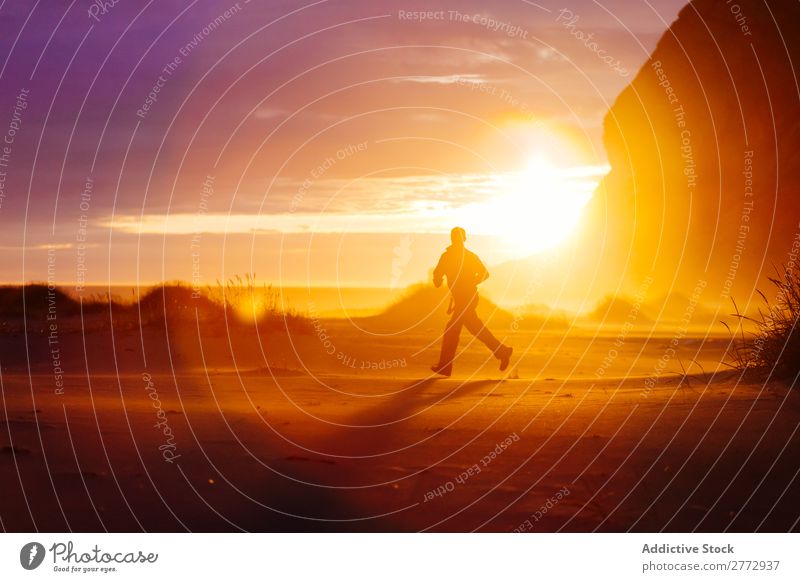 Running man on nature in sunlight Human being terrain Sunset Adventure Multicoloured Nature exploration motivation Freedom Sunlight Wilderness Landscape