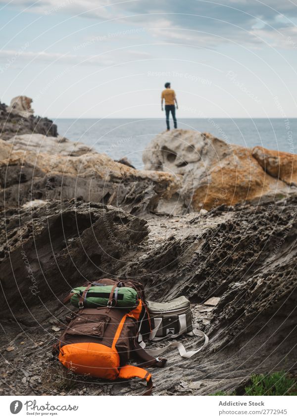 Traveler on rocks of ocean Human being traveler Ocean Dream Freedom exploration Cliff Coast Peaceful Backpacking Rock Vacation & Travel Vantage point Scene