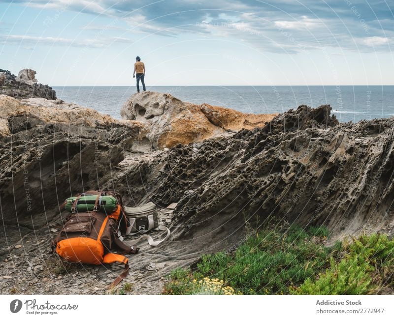 Traveler on rocks of ocean Human being traveler Ocean Dream Freedom exploration Cliff Coast Peaceful Backpacking Rock Vacation & Travel Vantage point Scene