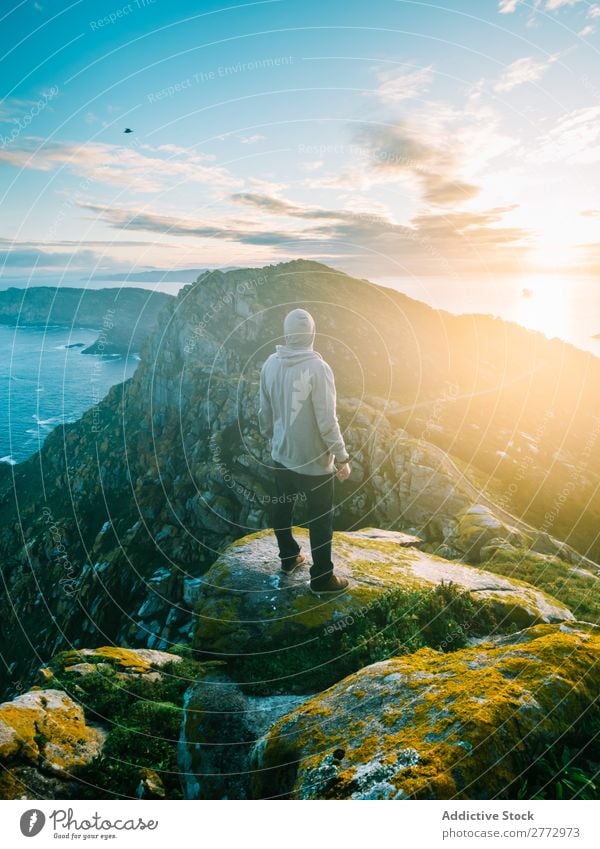 Traveler posing on amazing landscape Man traveler Panorama (Format) Ocean Rock Mountain Sunlight Virgin forest Dream Nature exploration Perspective Picturesque