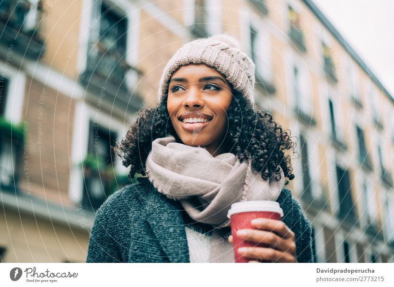 Young black woman drinking coffee wandering in the streets of Madrid on winter Woman Vacation & Travel City Town center Spain Exterior shot Student Cute Street