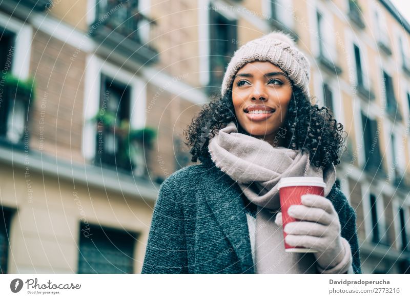 Young black woman drinking coffee wandering in the streets of Madrid on winter Woman Vacation & Travel City Town center Spain Exterior shot Student Cute Street