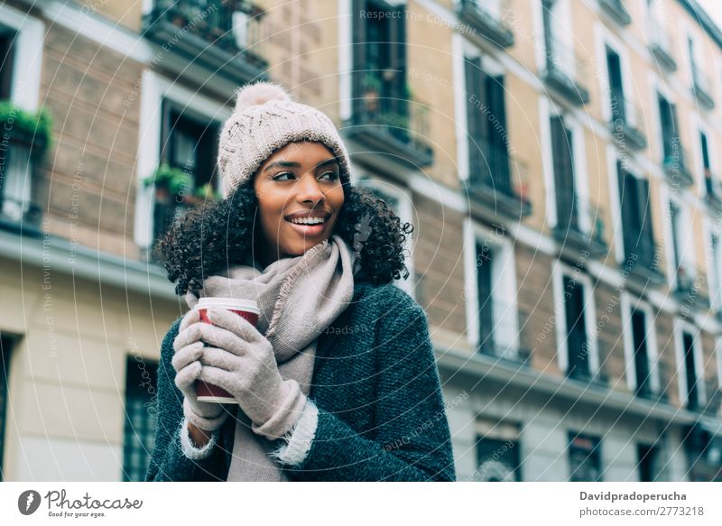 Young black woman drinking coffee wandering in the streets of Madrid on winter Woman Vacation & Travel City Town center Spain Exterior shot Student Cute Street