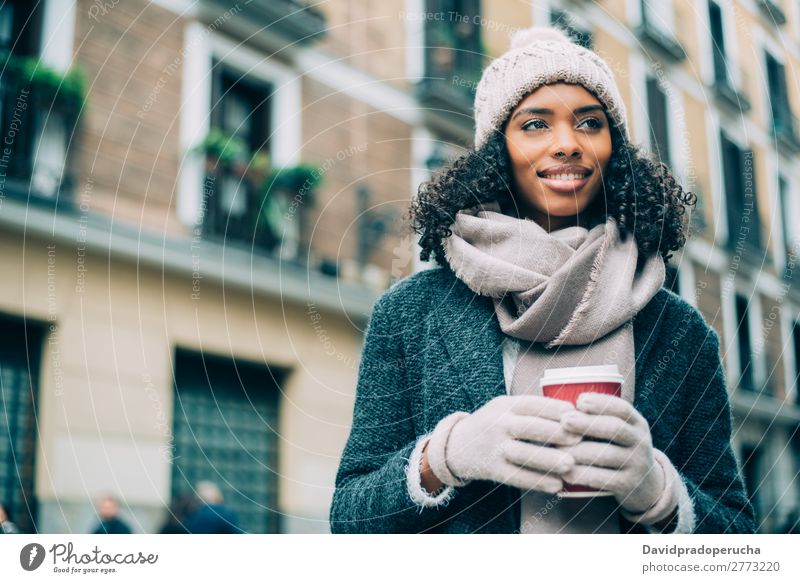 Young black woman drinking coffee wandering in the streets of Madrid on winter Woman Vacation & Travel City Town center Spain Exterior shot Student Cute Street