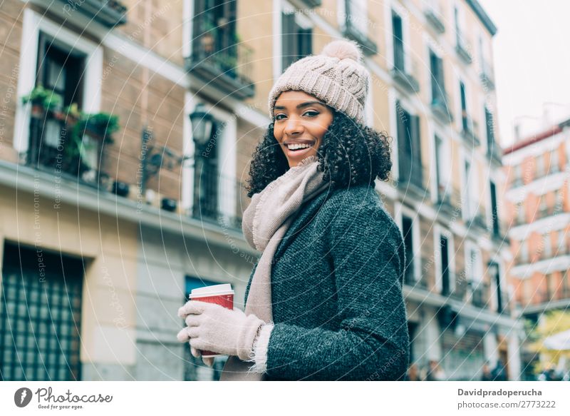 Young black woman drinking coffee wandering in the streets of Madrid on winter Woman Vacation & Travel City Town center Spain Exterior shot Student Cute Street