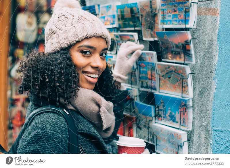 Young black woman drinking coffee wandering in the streets of Madrid on winter Woman Vacation & Travel City Town center Spain Exterior shot Student Cute Street