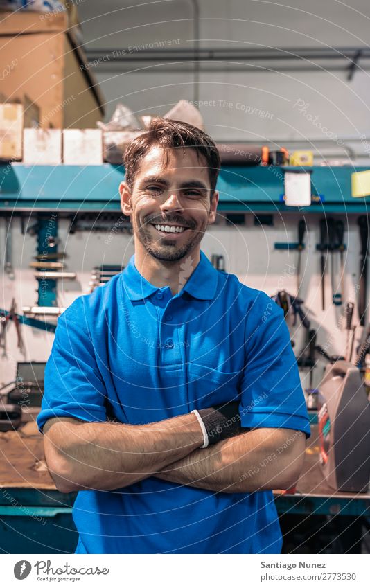 Portrait of Car Mechanic Man Portrait photograph portraiture Wall (building) Smiling Friendliness Background picture Tool varierty Blacksmith Board Box