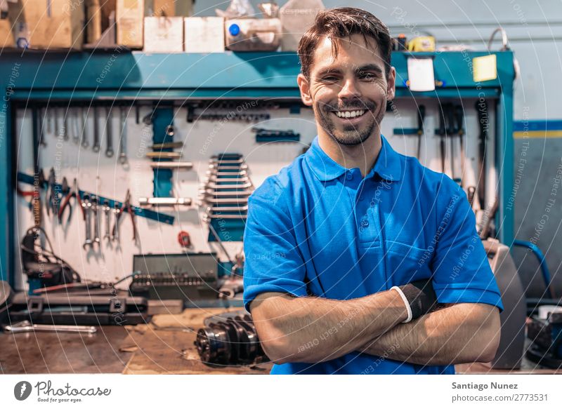 Portrait of Car Mechanic Man Portrait photograph portraiture Wall (building) Smiling Friendliness Background picture Tool varierty Blacksmith Board Box