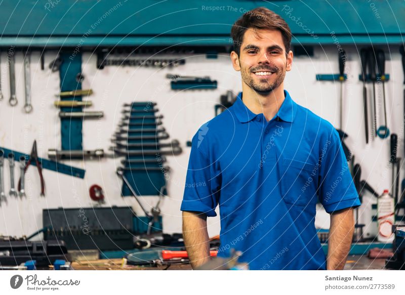 Portrait of Car Mechanic Man. Portrait photograph portraiture Wall (building) Smiling Friendliness Background picture Tool varierty Blacksmith Board Box