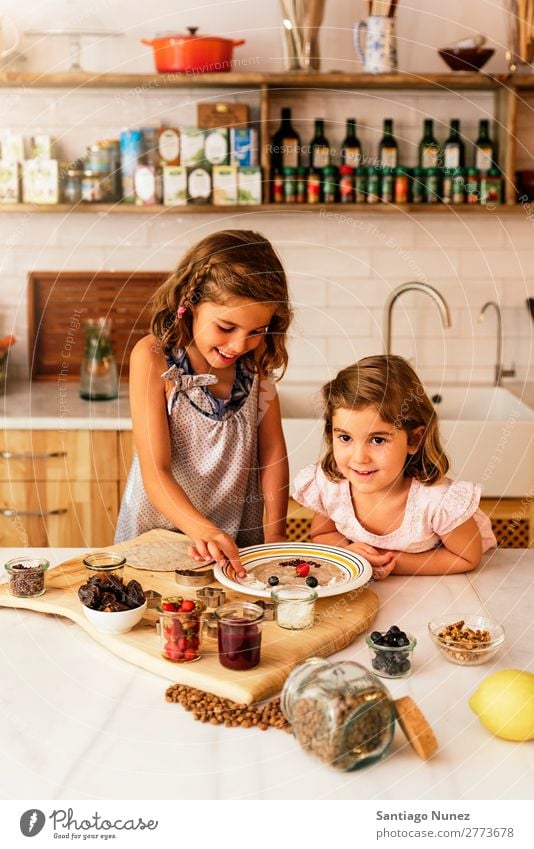 Little sisters girl preparing baking cookies. Child Girl Cooking Kitchen Chocolate Ice cream Strawberry Daughter Day Happy Joy Family & Relations Love Pizza