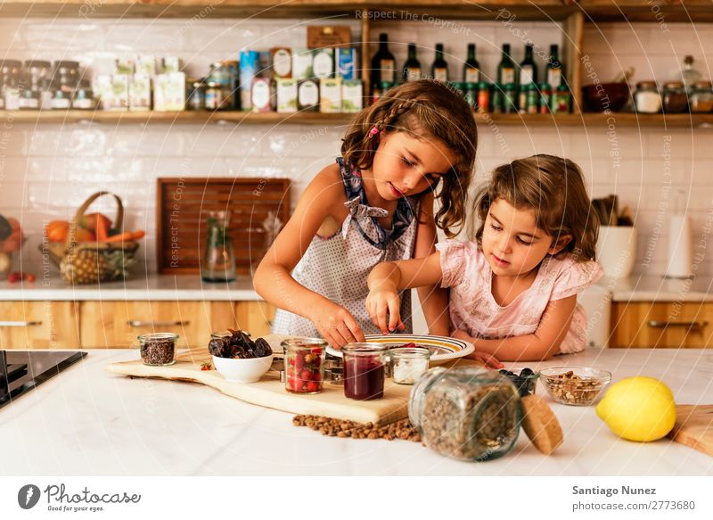 Little sisters girl preparing baking cookies. Child Girl Cooking Kitchen Chocolate Ice cream Strawberry Daughter Day Happy Joy Family & Relations Love Pizza