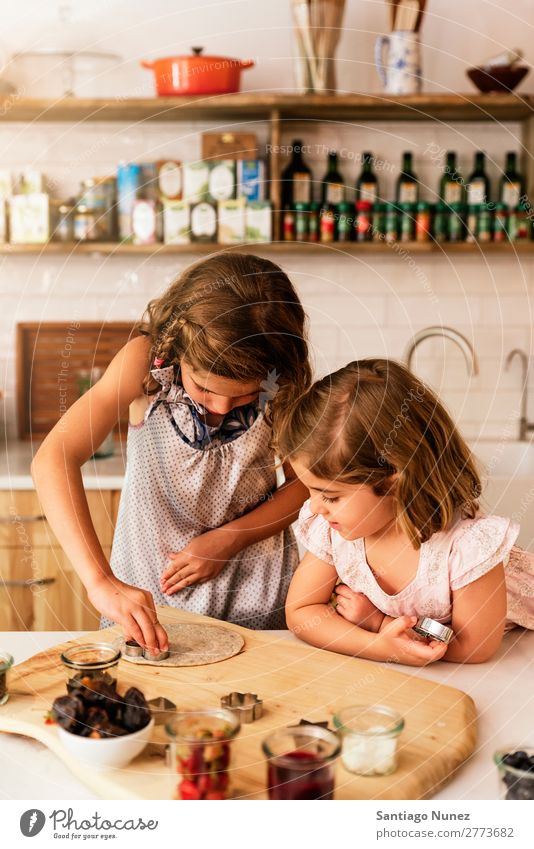 Little sisters girl preparing baking cookies. Child Girl Cooking Kitchen Chocolate Ice cream Daughter Day Happy Joy Family & Relations Love