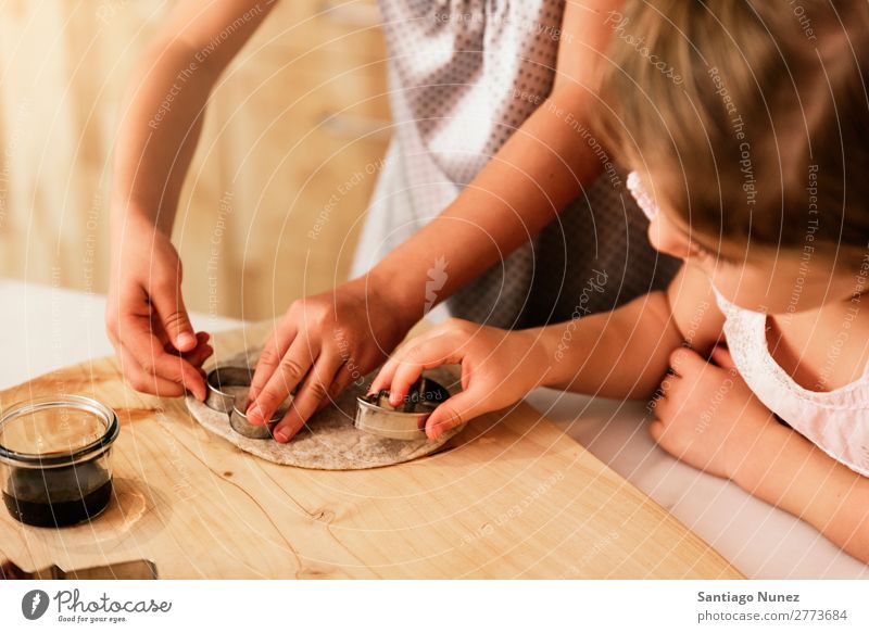 Little sisters girl preparing baking cookies. Child Girl Cooking Kitchen Chocolate Ice cream Daughter Day Happy Joy Family & Relations Love