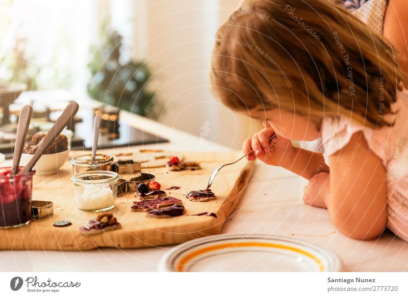 Little sisters girl preparing baking cookies. Child Girl Cooking Kitchen Chocolate Ice cream Strawberry Daughter Day Happy Joy Family & Relations Love