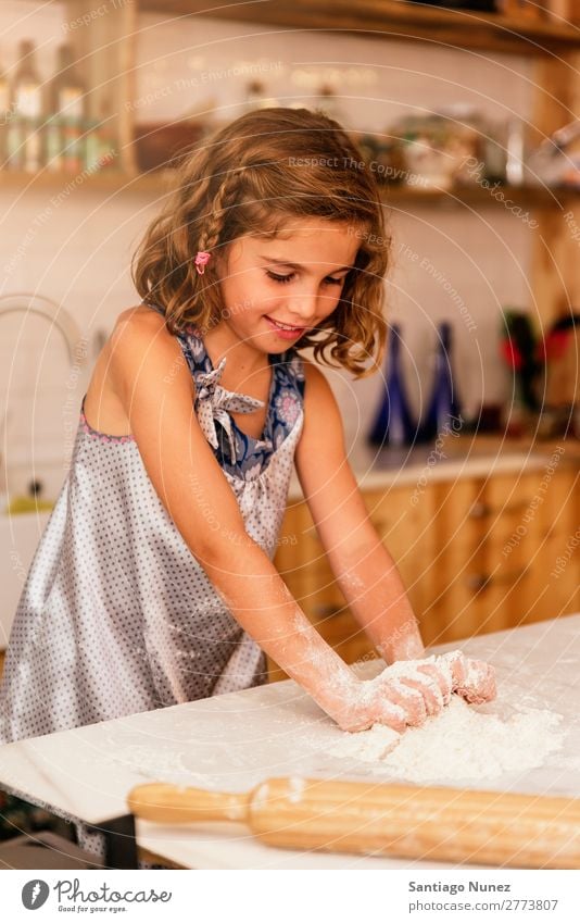 Little child girl kneading dough prepare for baking cookies. Child Girl Cook Cooking Kitchen Flour Chocolate Daughter Day Happy Joy Family & Relations Love