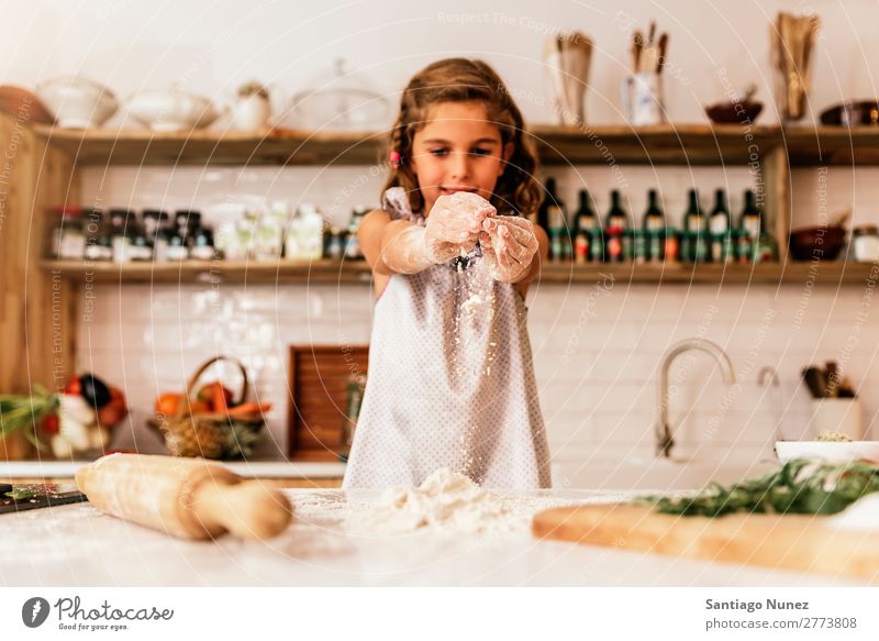 Little child girl kneading dough prepare for baking cookies. Child Girl Cook Cooking Kitchen Flour Chocolate Daughter Day Happy Joy Family & Relations Love