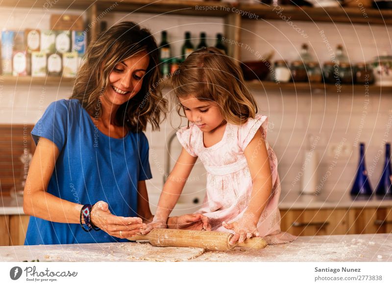 Little child girl kneading dough prepare for baking cookies. Mother Girl Cook Cooking Kitchen Flour Daughter Day Happy Joy Family & Relations Love Baking Food