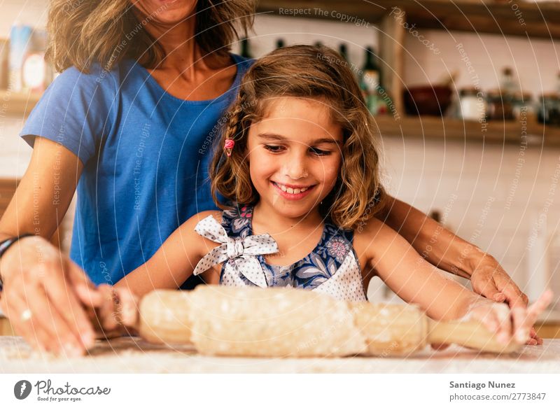 Little child girl kneading dough prepare for baking cookies. Mother Girl Cook Cooking Kitchen Flour Chocolate Daughter Day Happy Joy Family & Relations Love