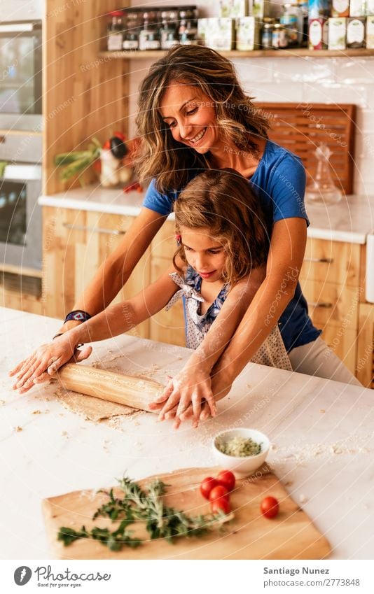 Little child girl kneading dough prepare for baking cookies. Mother Girl Cook Cooking Kitchen Flour Chocolate Daughter Dough Day Happy Joy Family & Relations