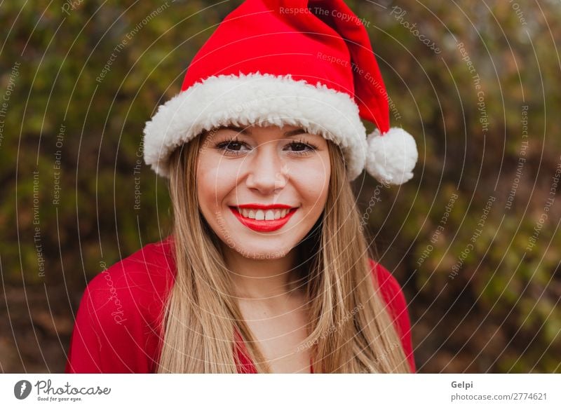 Young woman with Christmas hat in the forest Lifestyle Joy Happy Beautiful Face Calm Winter Christmas & Advent Human being Woman Adults Lips Nature Fog Tree