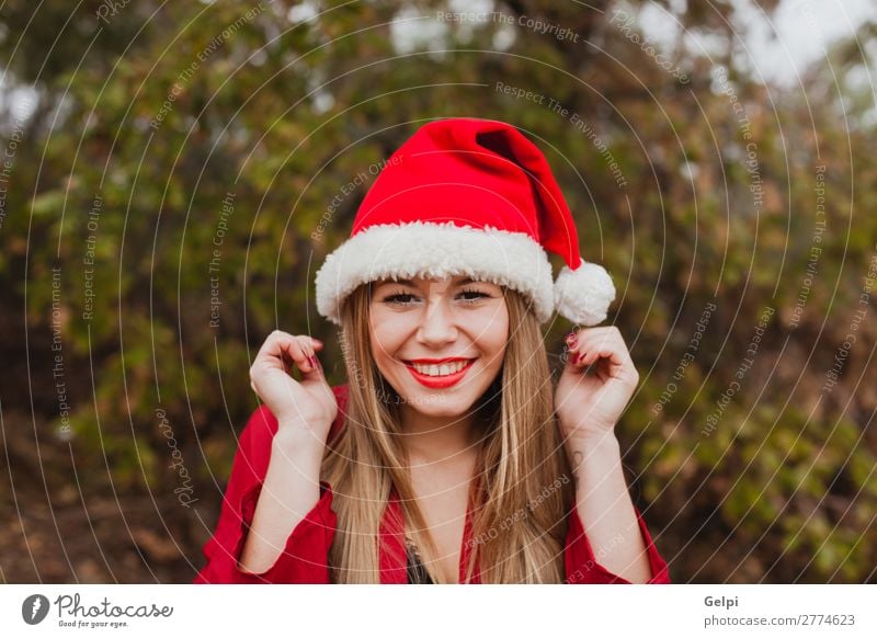 Young woman with Christmas hat in the forest Lifestyle Joy Happy Beautiful Face Calm Winter Christmas & Advent Human being Woman Adults Lips Nature Fog Tree