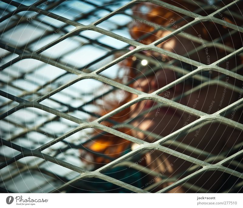 Woman with sunglasses between diagonal bars Human being Adults 45 - 60 years Sunglasses Red-haired Long-haired Sadness Protection Humanity Fatigue Inhibition