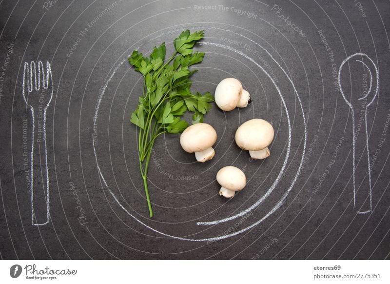 Mushrooms and parsley on slate table. Marjoram Preparation whole White Horizontal Sage Black Herbs and spices Raw Oregano Rosemary Dark Slate Cut