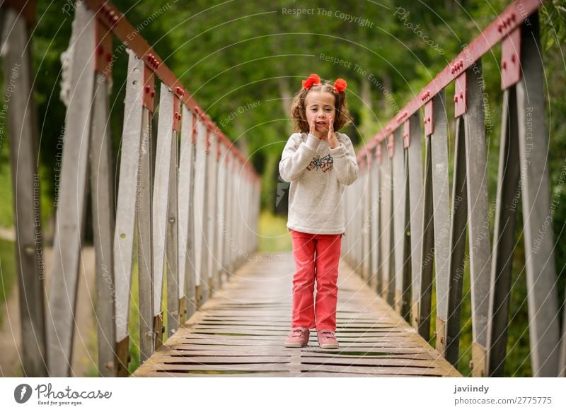 Cute little girl having fun in a rural bridge Joy Happy Beautiful Life Playing Child Human being Feminine Girl Infancy 1 3 - 8 years Nature Flower Bridge