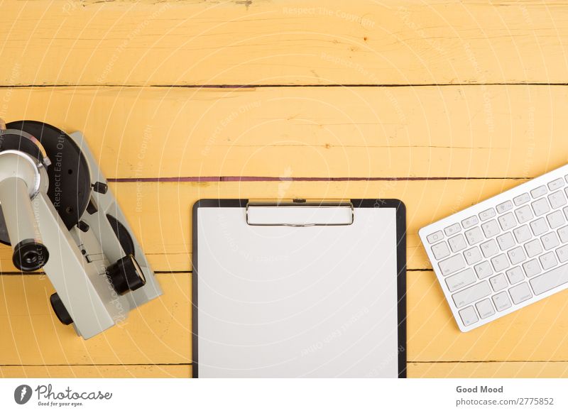 microscope, blank clipboard, computer keyboard on yellow desk Health care Medication Desk Table Science & Research School Study Classroom Academic studies