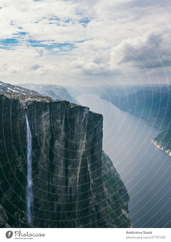 Breathtaking view of huge rock with waterfall Rock Height Waterfall Landscape Dramatic scenery Freedom cascade Mountain Panorama (Format) Vantage point Nature