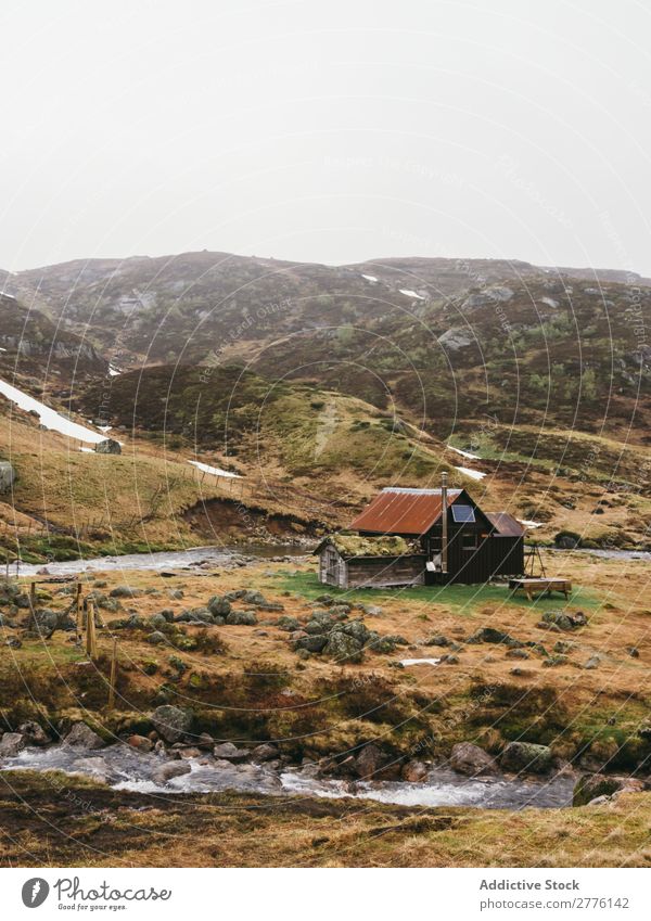 Abandoned house on shore in mountains Landscape scenery Mountain House (Residential Structure) abandoned Old Vantage point Exterior River Building Wanderlust