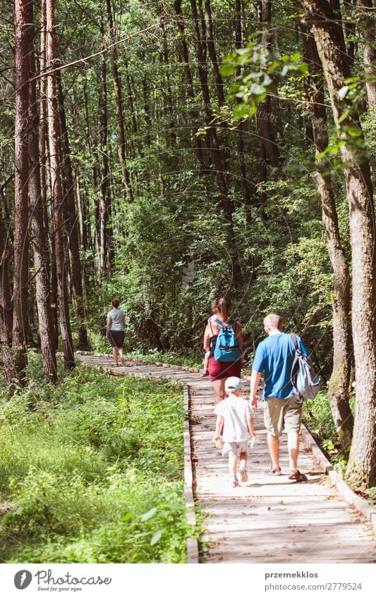 Family going a path in forest Lifestyle Vacation & Travel Trip Summer Child Boy (child) Woman Adults Man Parents Mother Father Family & Relations Infancy Nature