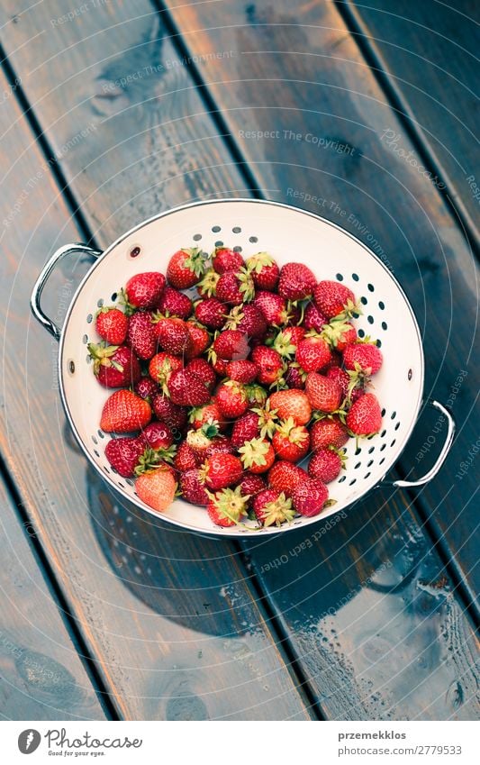 Bowl of fresh strawberries sprinkled raindrops on wooden table Fruit Vegetarian diet Summer Table Nature Wood Fresh Delicious Natural Juicy Red food freshly