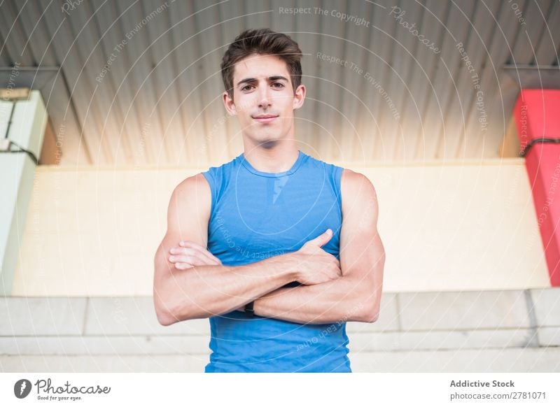 Muscular man posing at camera Man Stadium Posture Rest sportsman Sports Fitness hands crossed Practice Athlete Relaxation Adults Sprinter Break Sportswear