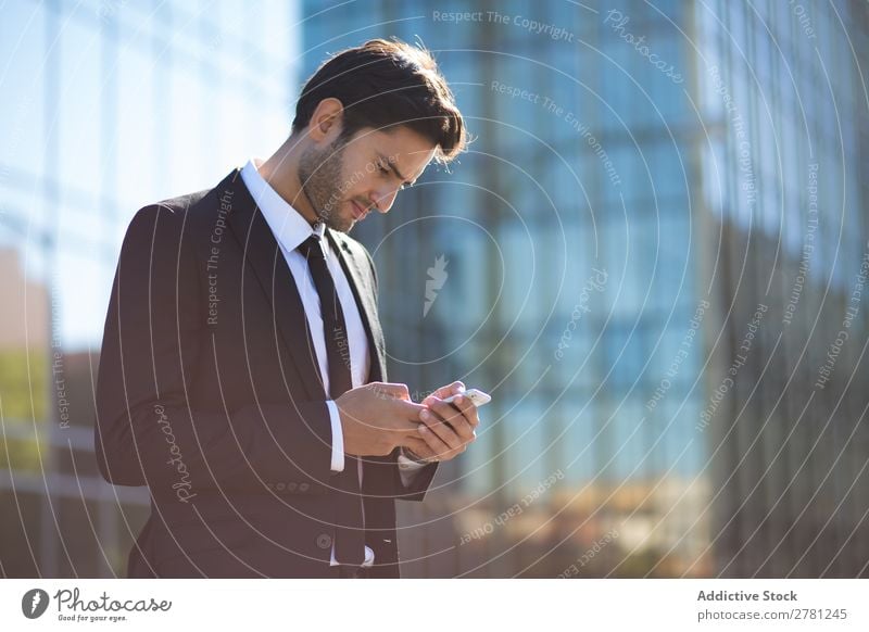 Elegant Young Businessman in the Street Using a Mobile Phone Man Fashion handsome Youth (Young adults) Looking Model Human being Background picture Suit Modern