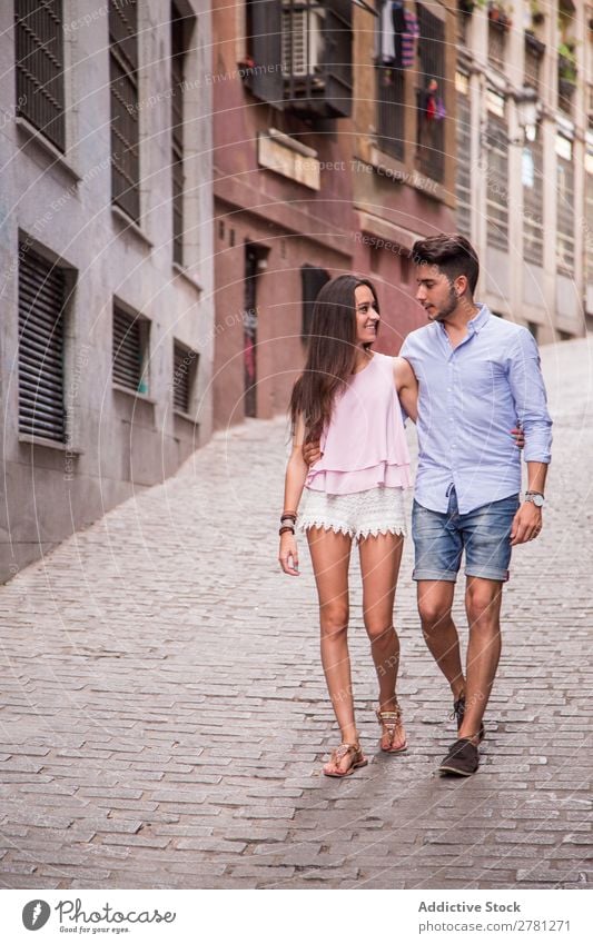 Happy couple walking on street Couple Embrace Walking Woman Face to face Style tender Man Human being embracing Love Lifestyle romantic Caucasian