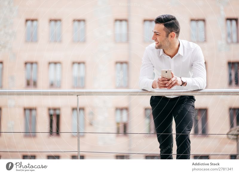 Happy Businessman Holding Smart Phone While Standing Against Building 20s Adults Architecture Away Businesspeople Businessperson Caucasian Communication