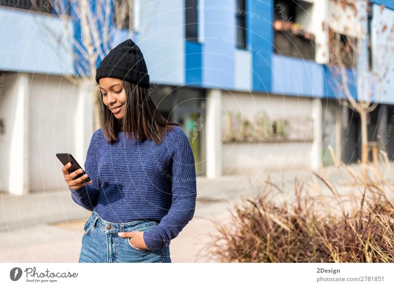 Happy woman with hat in city street, while using technology Style Beautiful Hair and hairstyles PDA Technology Human being Feminine Young woman