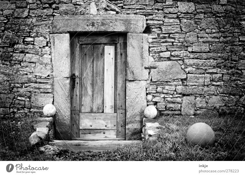 at the Geröllheimers Deserted Hut Ruin Wall (barrier) Wall (building) Facade Door Decoration Stone wall Stony Sphere Old Dark Gloomy Closed Wooden door