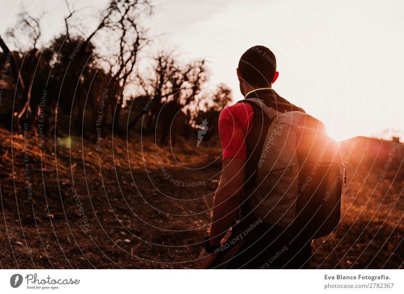 young hiker man at sunset Lifestyle Leisure and hobbies Sports Hiking Human being Masculine Young man Youth (Young adults) Man Adults 1 30 - 45 years Nature