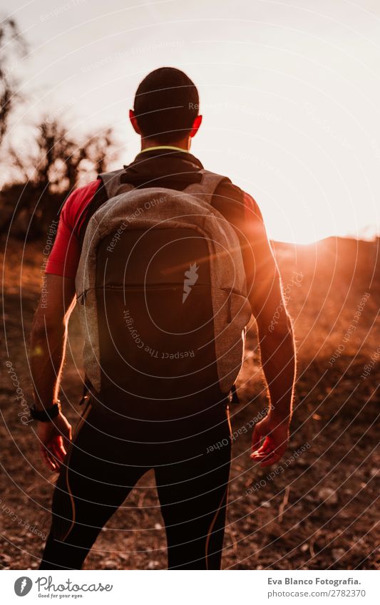 young hiker man at sunset Lifestyle Leisure and hobbies Sports Hiking Human being Masculine Young man Youth (Young adults) Man Adults 1 30 - 45 years Nature