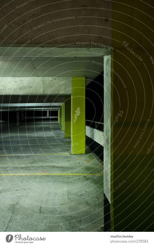 multi-storey car park Parking garage Threat Dark Sharp-edged Cold Town Blue Yellow Gray Black Interior shot Copy Space left Copy Space bottom Night