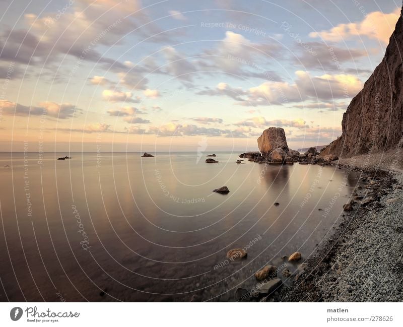 crashed Landscape Sky Clouds Summer Beautiful weather Coast Beach Bay Ocean Brown Calm Moody Stone Rock Fragment Colour photo Exterior shot Deserted Dawn Day